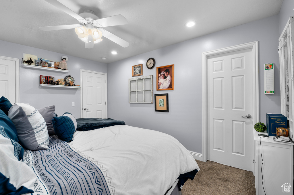 Carpeted bedroom featuring a ceiling fan and recessed lighting