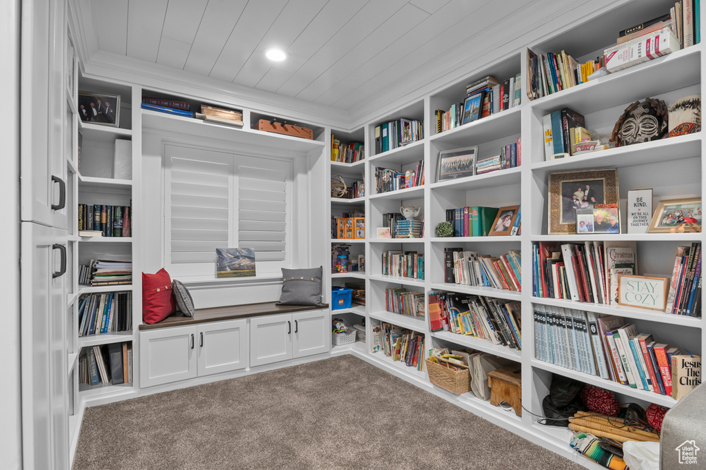 Sitting room featuring carpet and wood ceiling