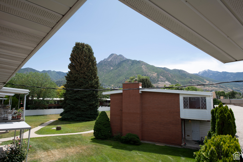 View of grassy yard featuring a mountain view