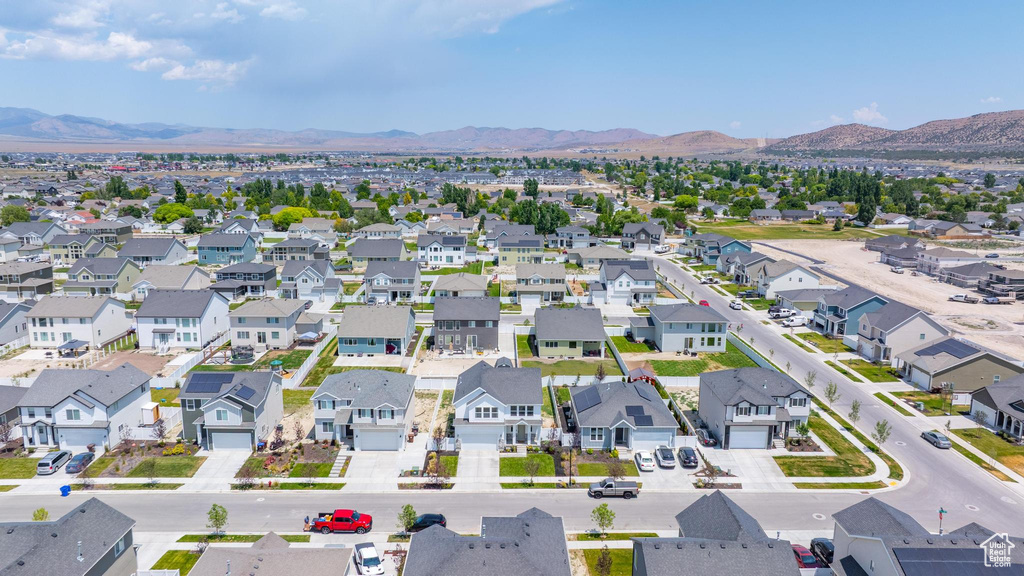 Aerial view of residential area featuring a mountainous background