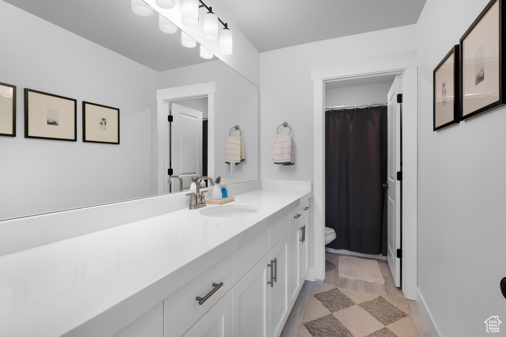 Bathroom featuring toilet and vanity
