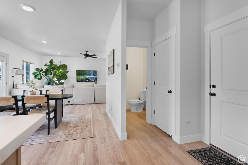 Dining space with light wood-style flooring, ceiling fan, and recessed lighting