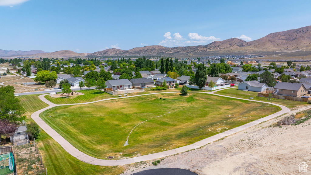 Aerial perspective of suburban area with a mountain backdrop
