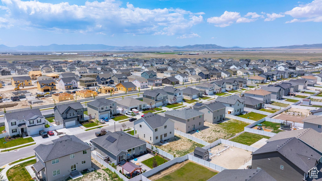 Aerial perspective of suburban area with a mountain backdrop