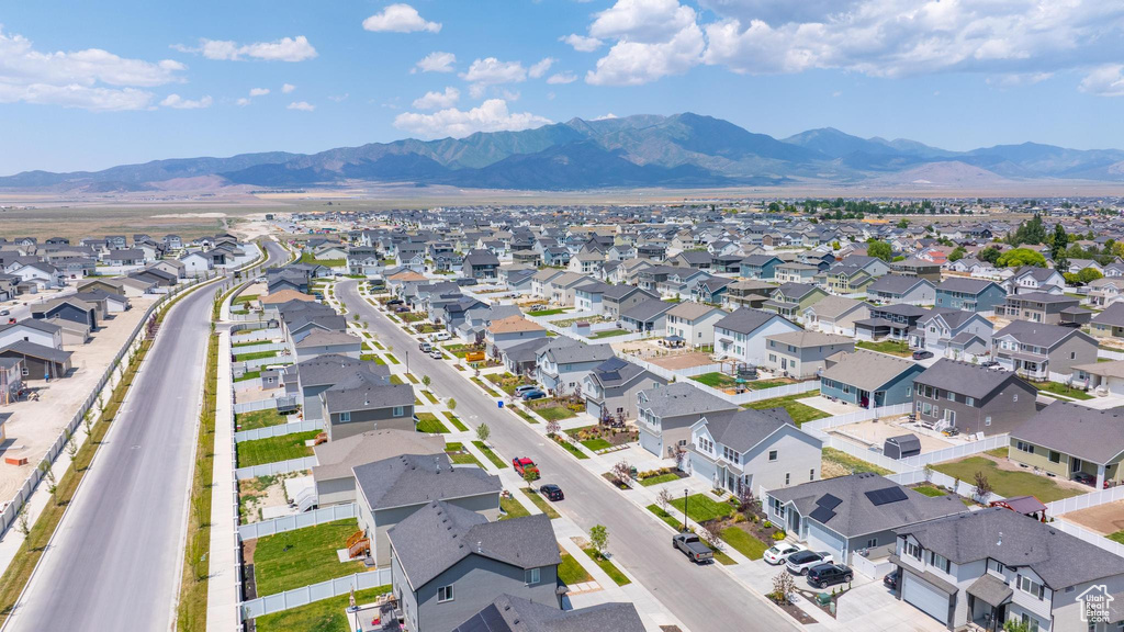 Aerial perspective of suburban area featuring a mountain backdrop