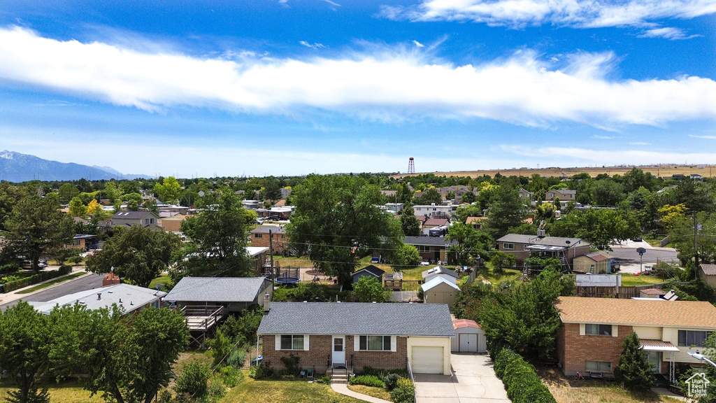 Aerial perspective of suburban area featuring a mountain backdrop