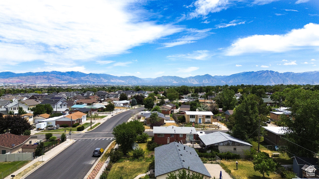 View of mountain backdrop featuring nearby suburban area