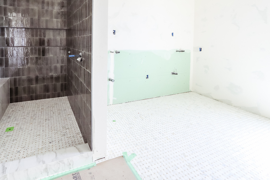 Full bathroom with a tile shower