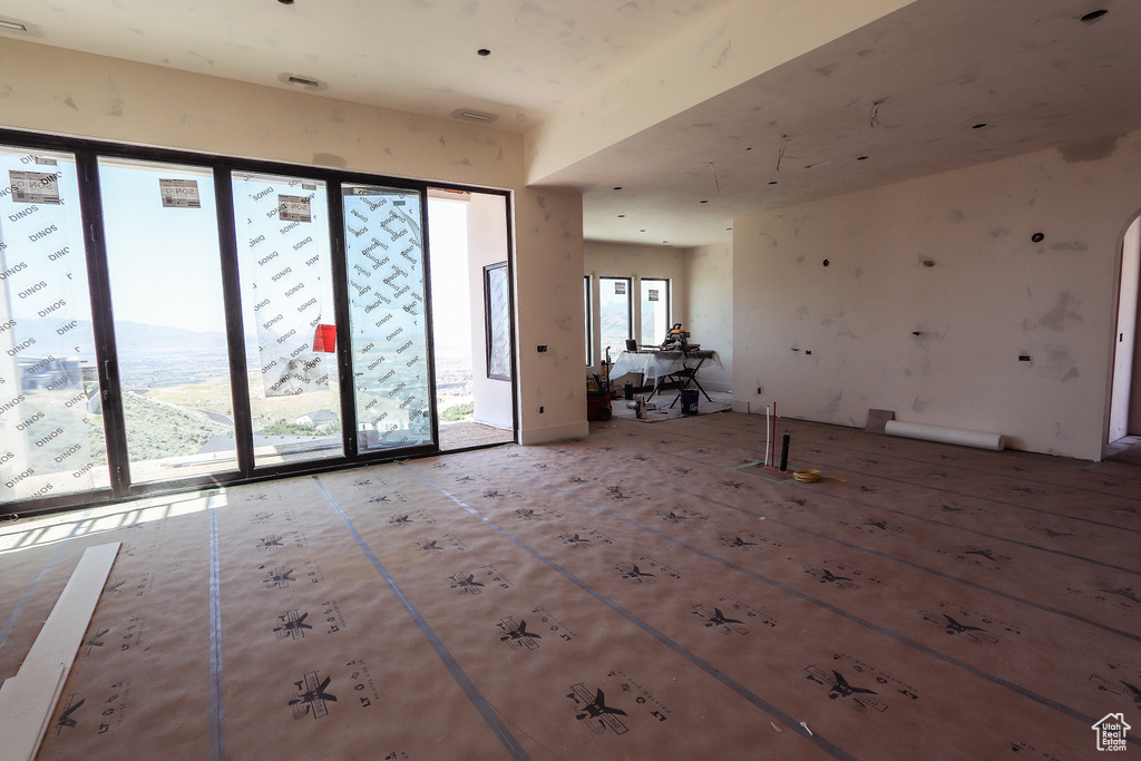 Empty room featuring arched walkways