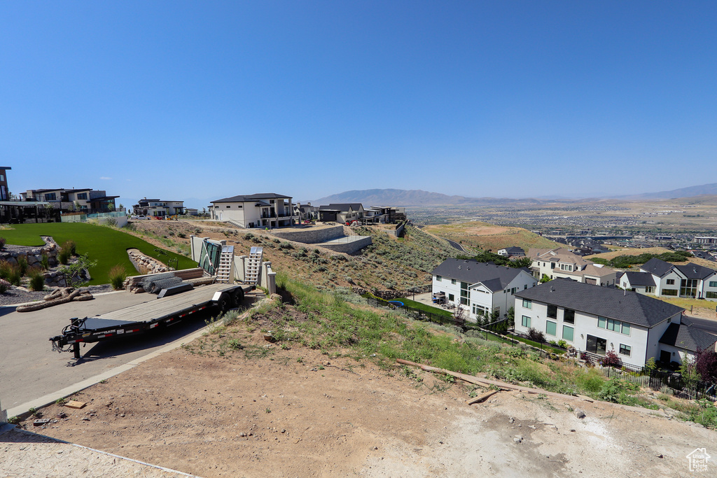 Aerial perspective of suburban area featuring a mountain backdrop