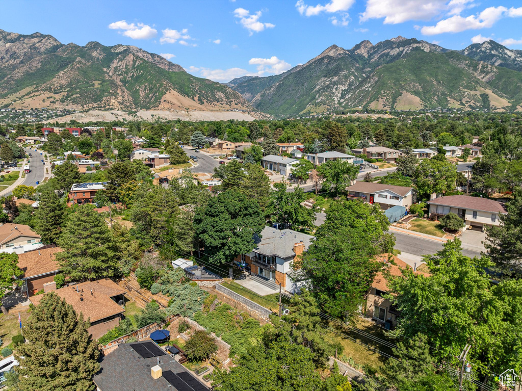 View of property location featuring a mountainous background and nearby suburban area