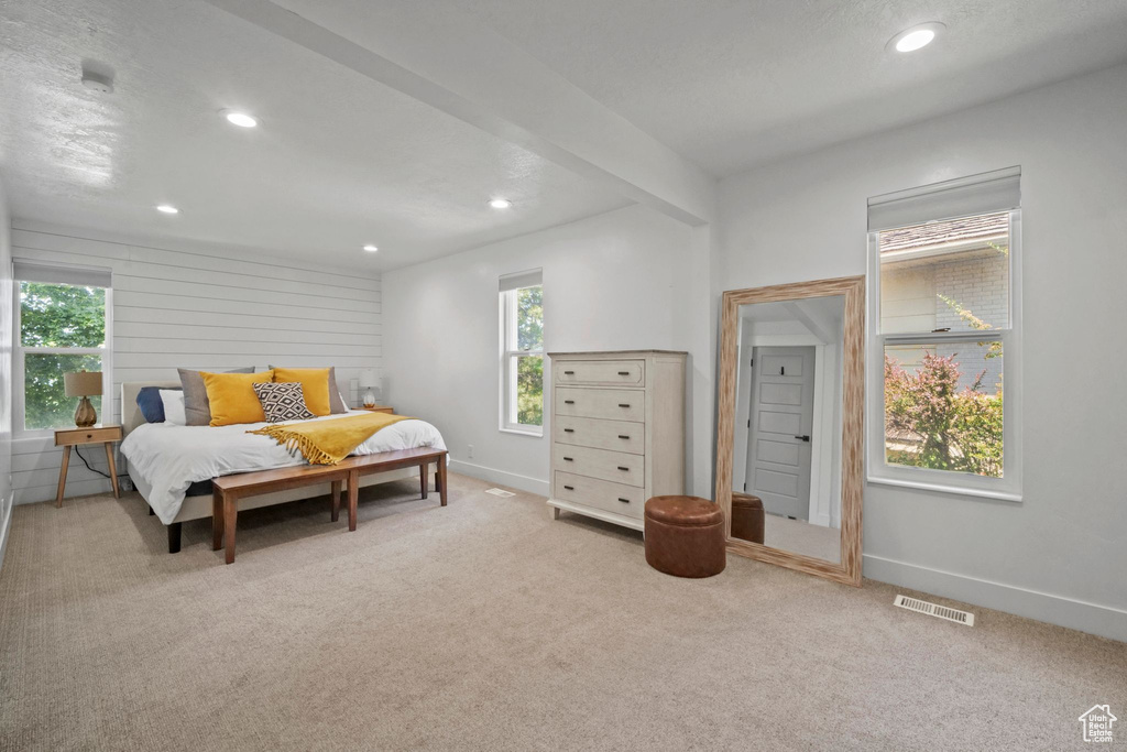 Bedroom with multiple windows, recessed lighting, and carpet floors