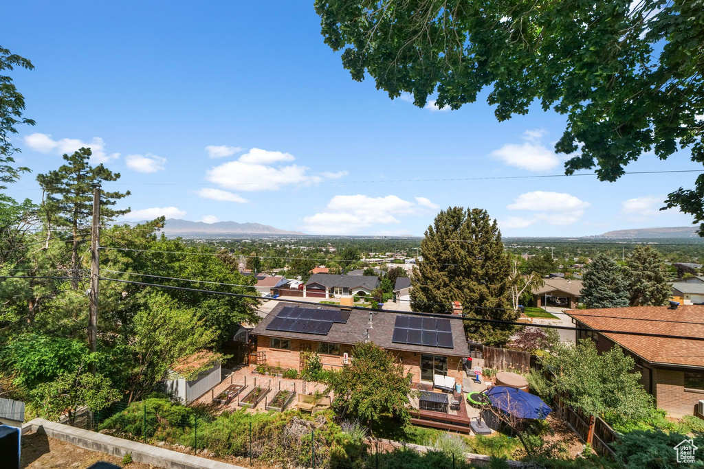 Aerial view of residential area featuring a mountain backdrop