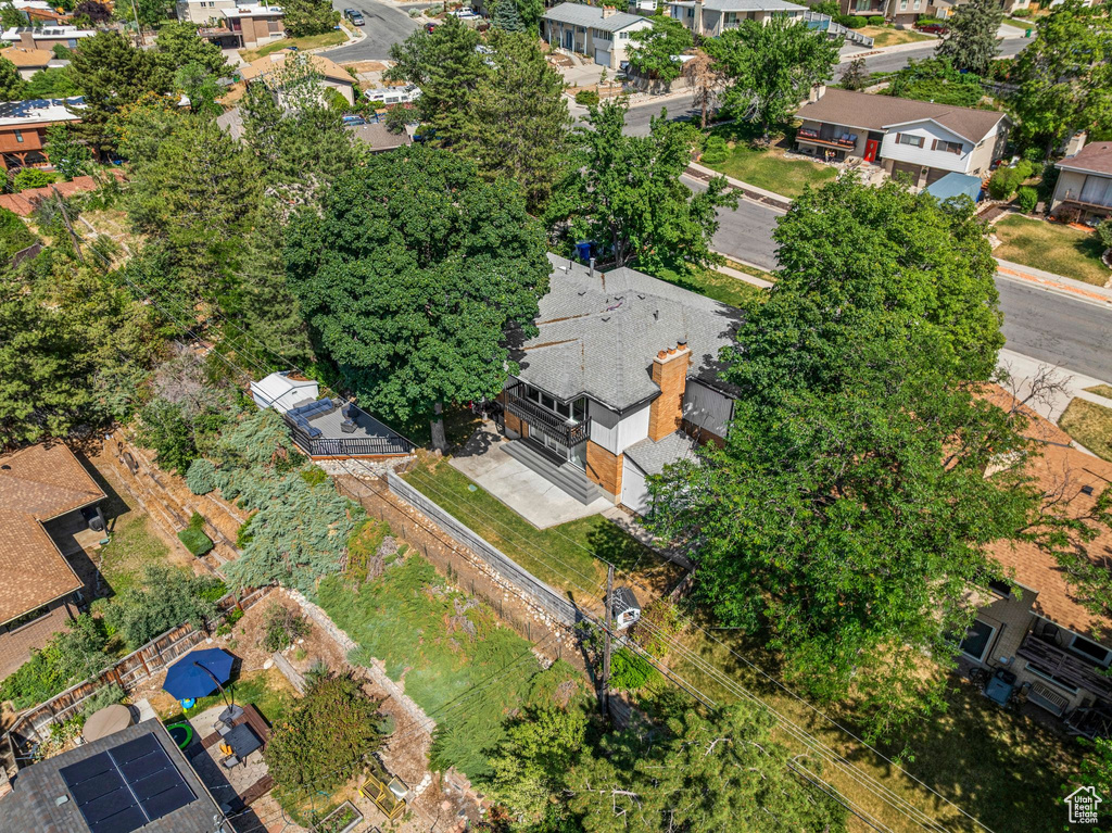 Aerial view of property and surrounding area with nearby suburban area
