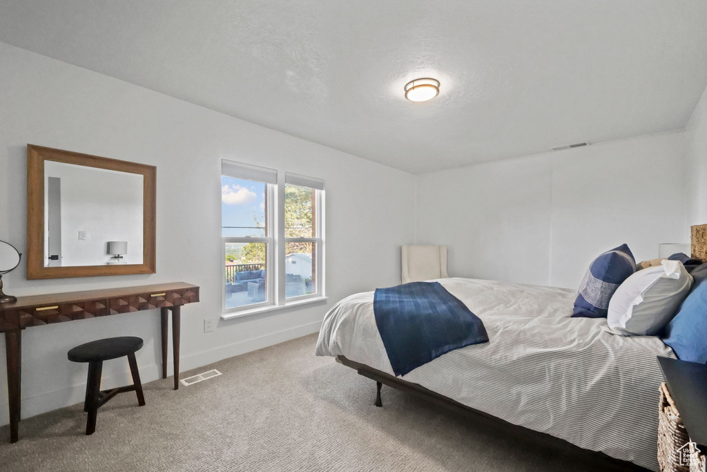 Carpeted bedroom with baseboards