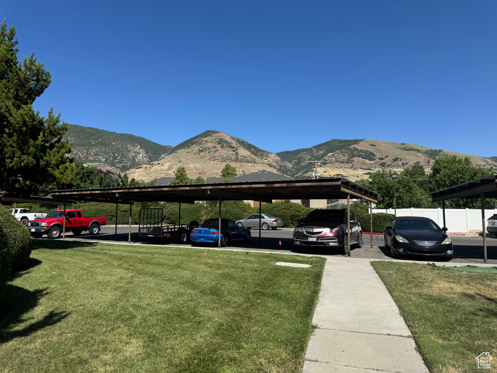 Partially covered parking lot with a mountain view