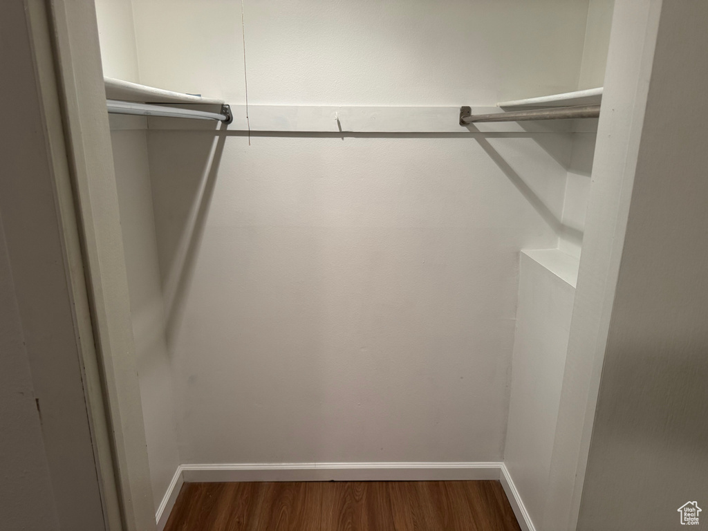 Spacious closet with wood finished floors