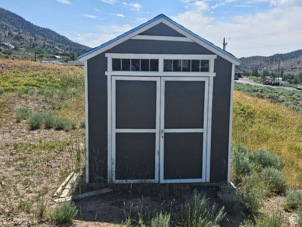 View of shed with a mountain view
