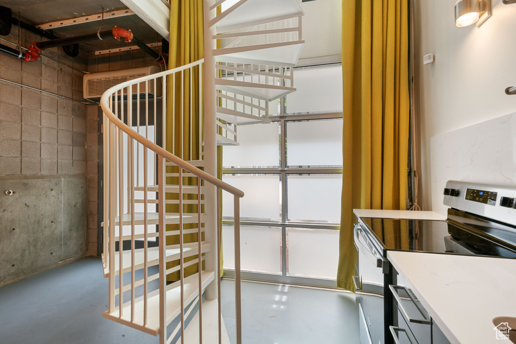Stairs featuring concrete floors