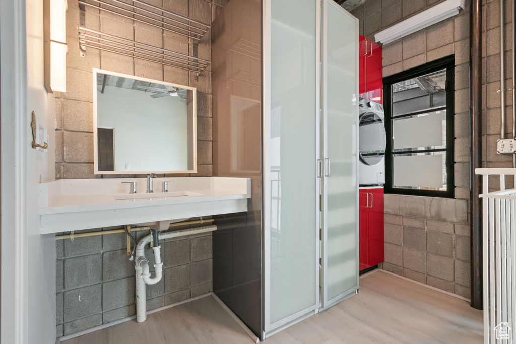 Bathroom featuring wood finished floors and ceiling fan