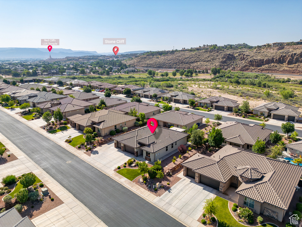 Aerial perspective of suburban area with a mountain backdrop