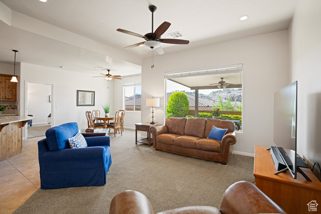 Living area featuring recessed lighting and ceiling fan
