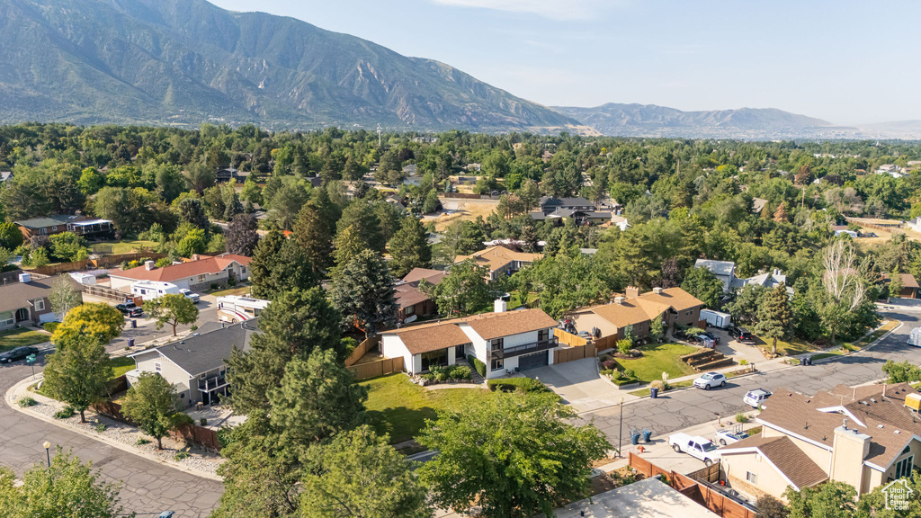 Aerial perspective of suburban area with a mountain backdrop