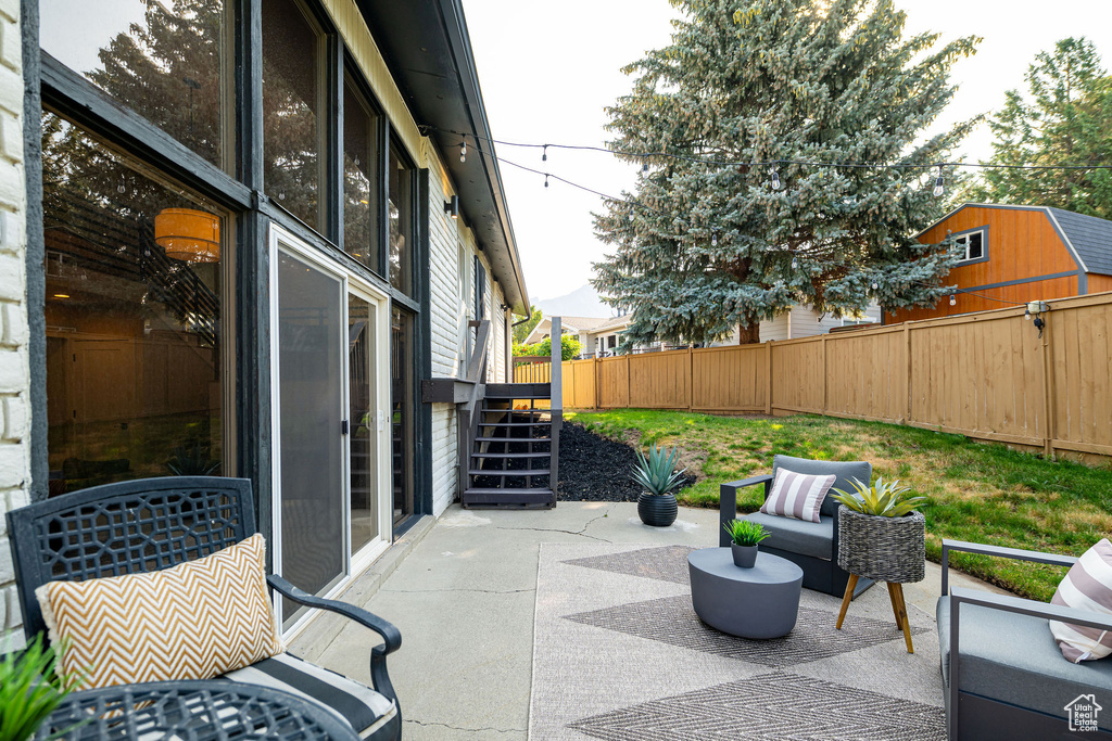 Fenced backyard with a patio