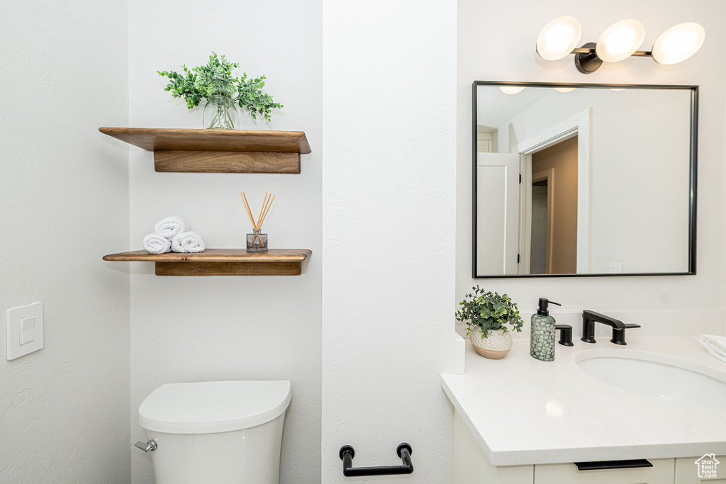 Bathroom with vanity and toilet