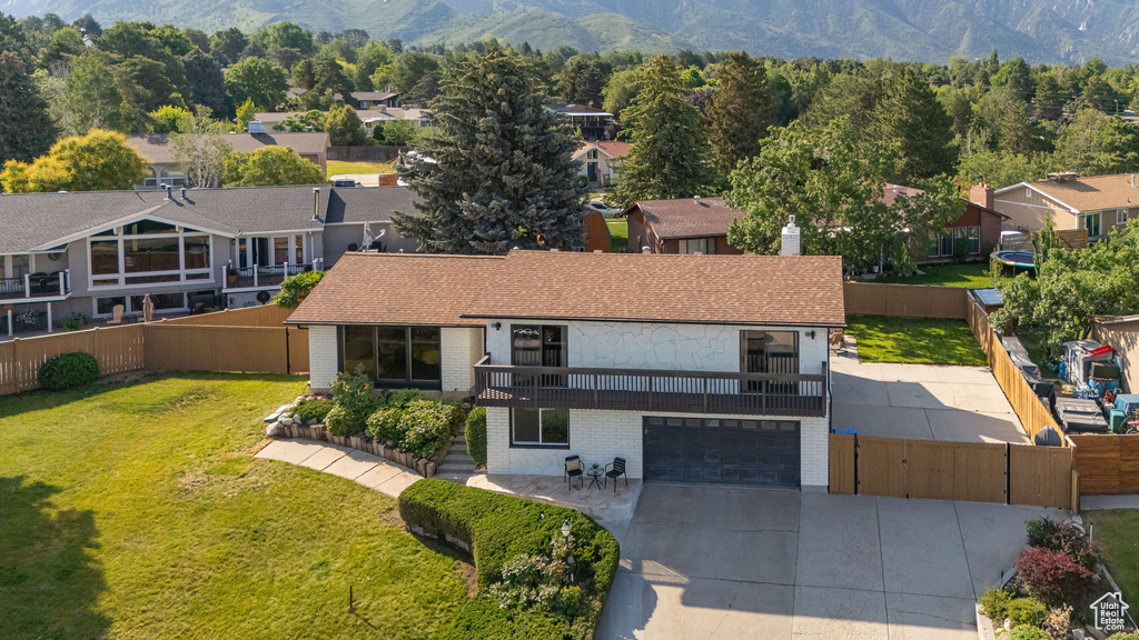 Aerial perspective of suburban area featuring a mountain backdrop
