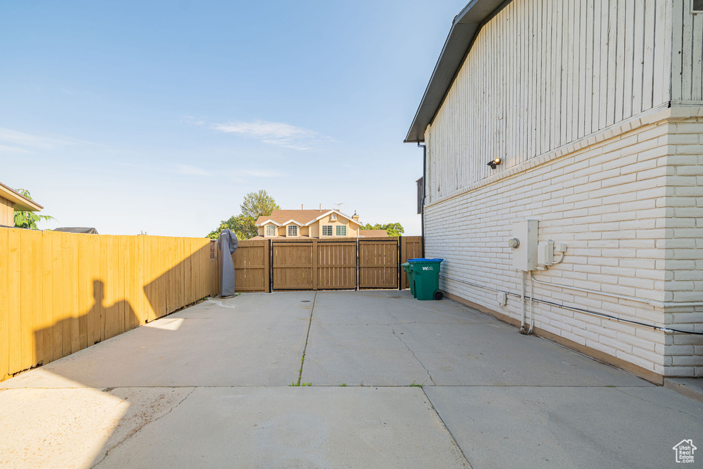 Fenced backyard with a patio area