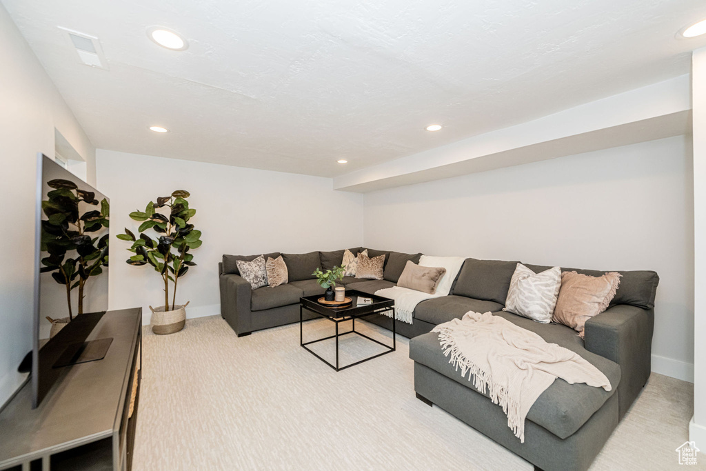 Living room featuring carpet flooring and recessed lighting