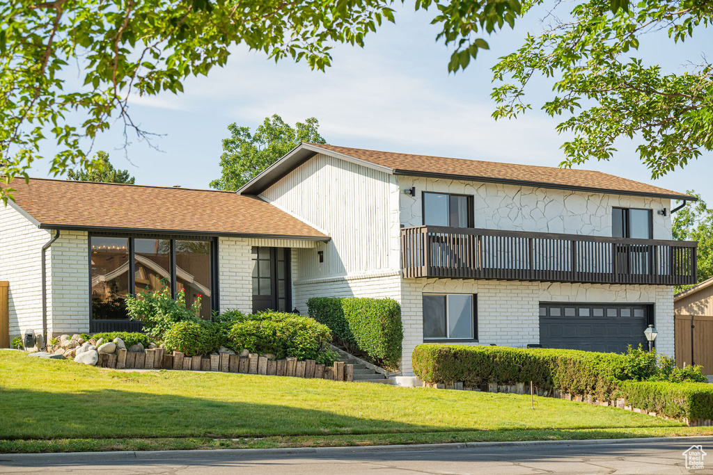 View of property with an attached garage