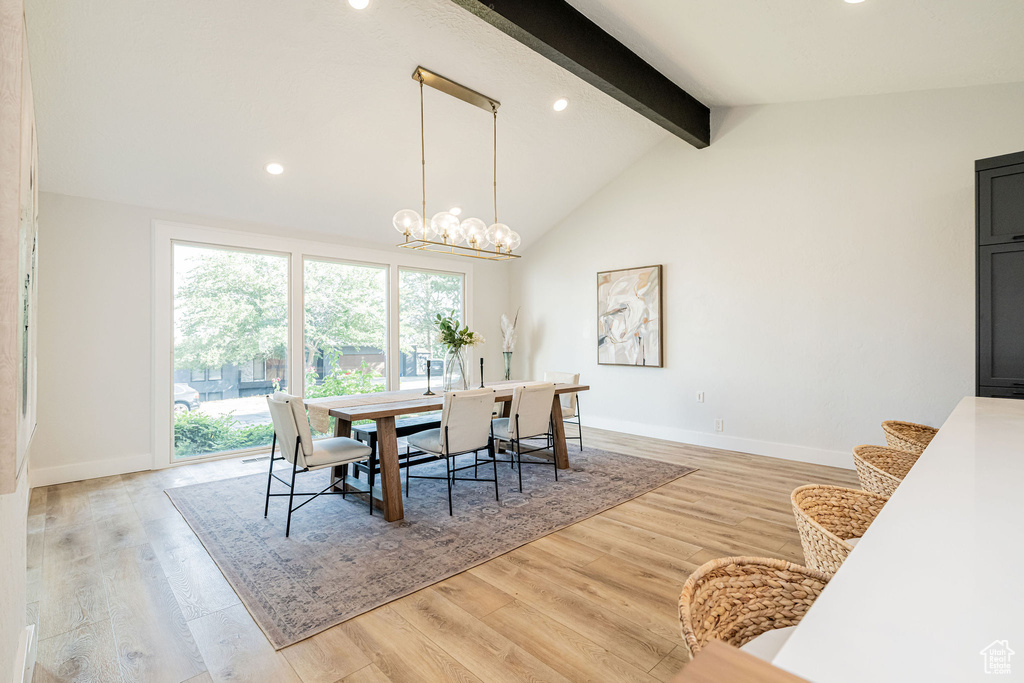 Dining area with light wood-type flooring, recessed lighting, and a chandelier