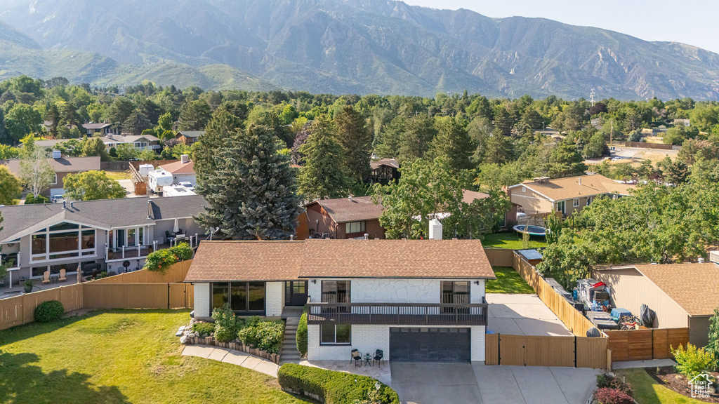 Aerial view of residential area featuring a mountain backdrop