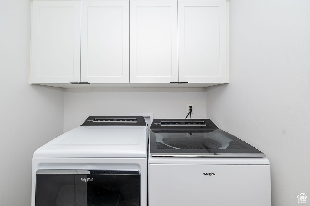 Washroom with independent washer and dryer and cabinet space