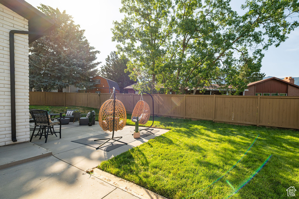 Fenced backyard featuring a patio area