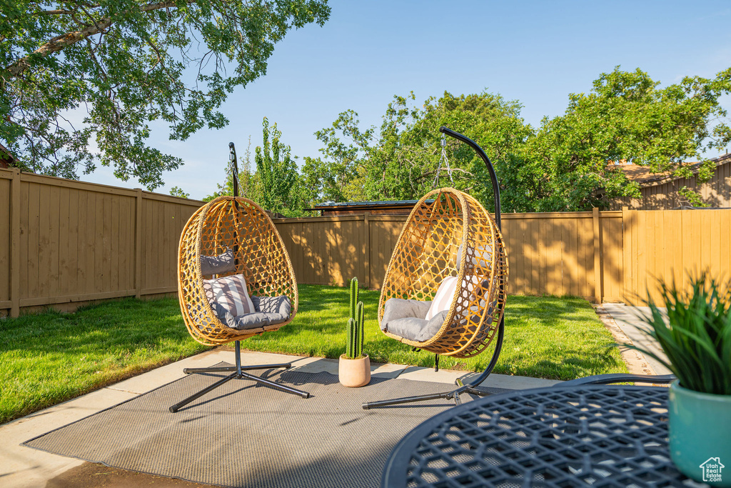 Fenced backyard with a patio