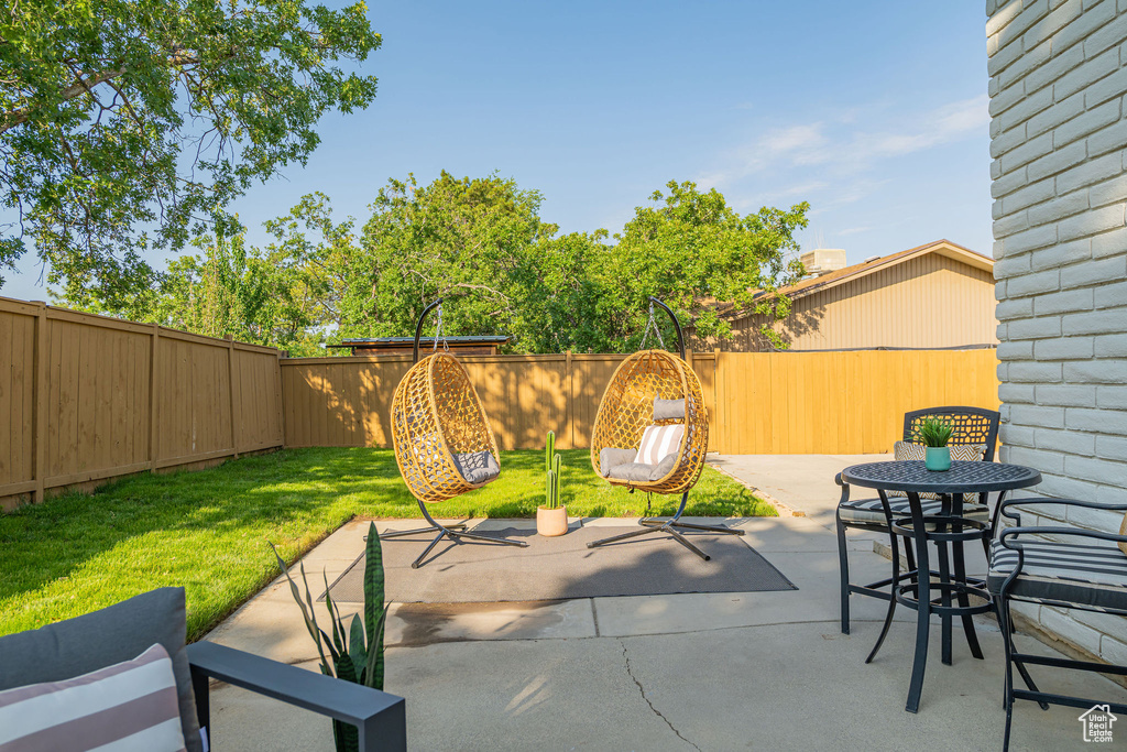 Fenced backyard featuring a patio