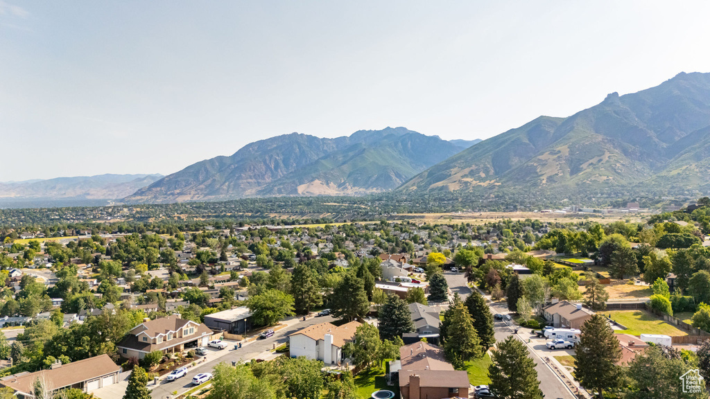 Aerial view of residential area featuring a mountainous background