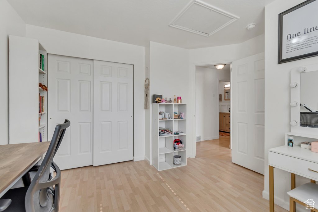Office featuring attic access and light wood-type flooring