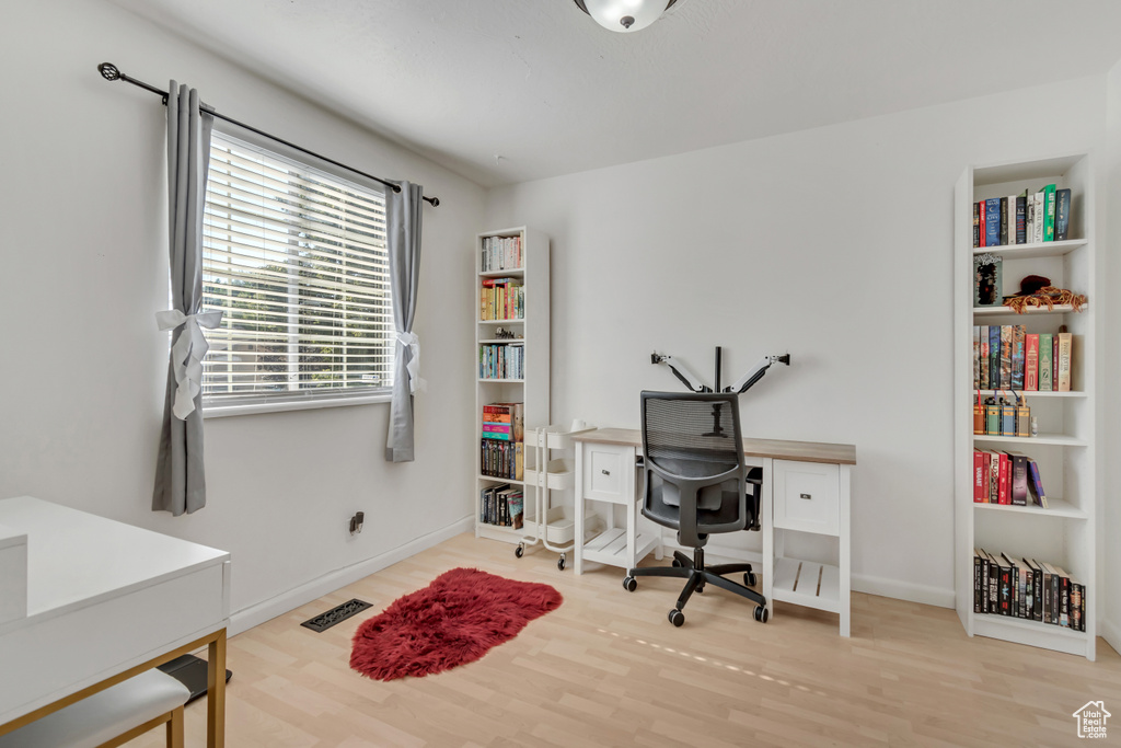 Office area with wood finished floors and baseboards
