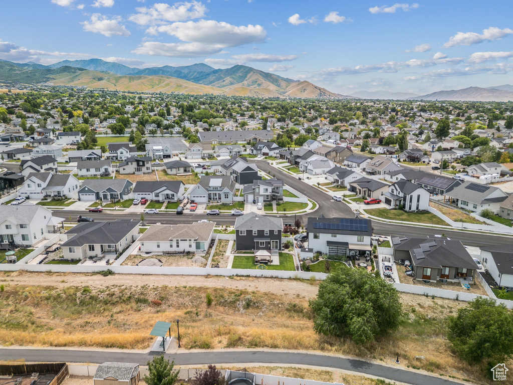 Aerial view of residential area featuring a mountainous background