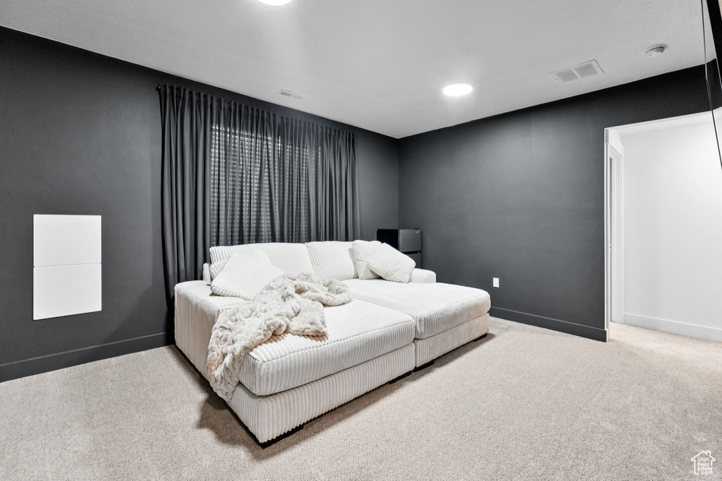 Carpeted bedroom featuring baseboards and recessed lighting