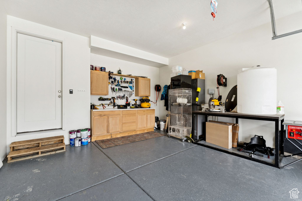 Garage featuring a workshop area