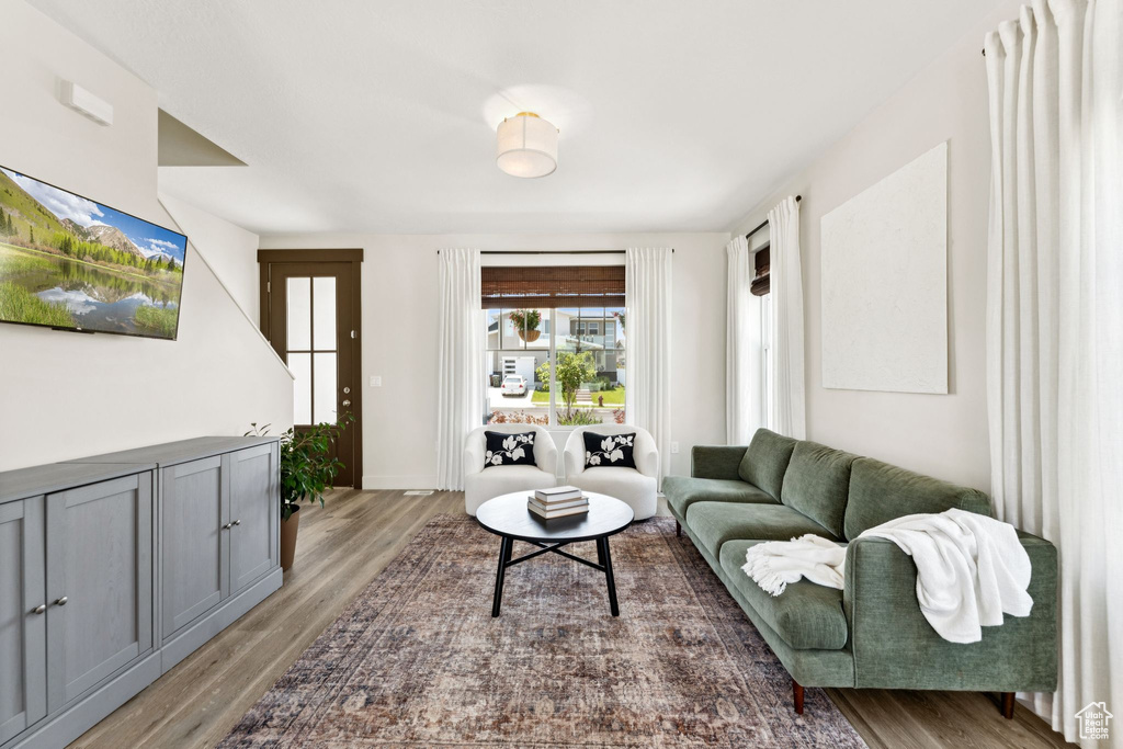 Living room with wood finished floors and baseboards