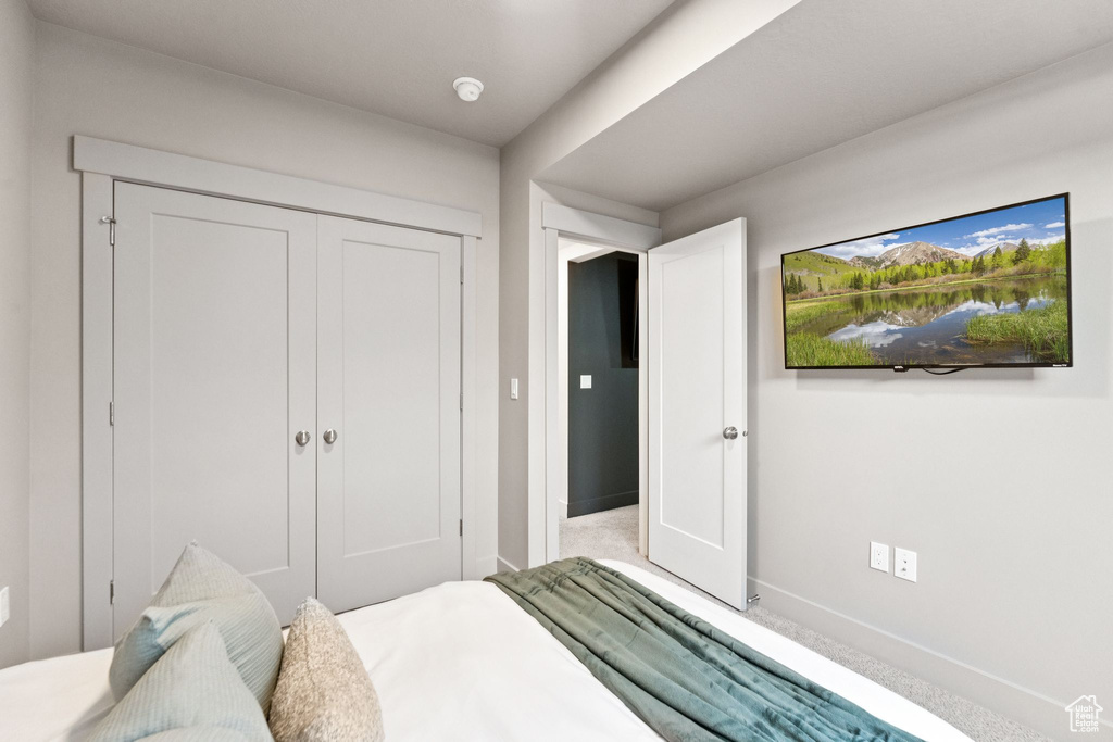 Bedroom with a closet and baseboards