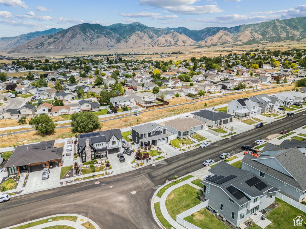 Aerial view of residential area featuring a mountain backdrop