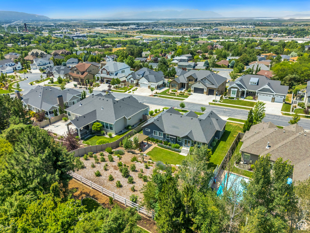 Aerial perspective of suburban area with a pool