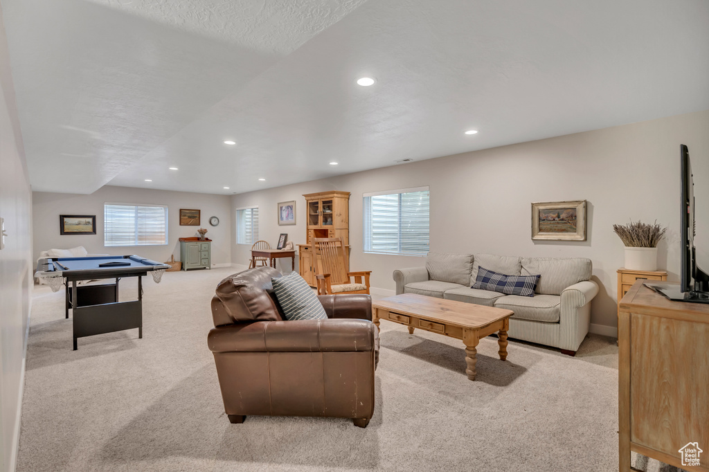 Living area featuring carpet, recessed lighting, and healthy amount of natural light
